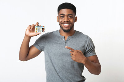 A Selfie of a Man Holding a Ghana Card